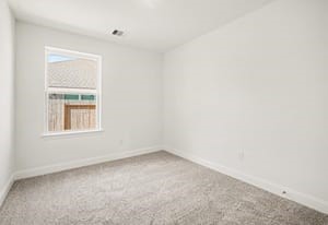 29 Greenbriar Loop Angleton, TX 77515 - Photo 8 of 19 Good-sized secondary bedroom with plenty of space and natural light.