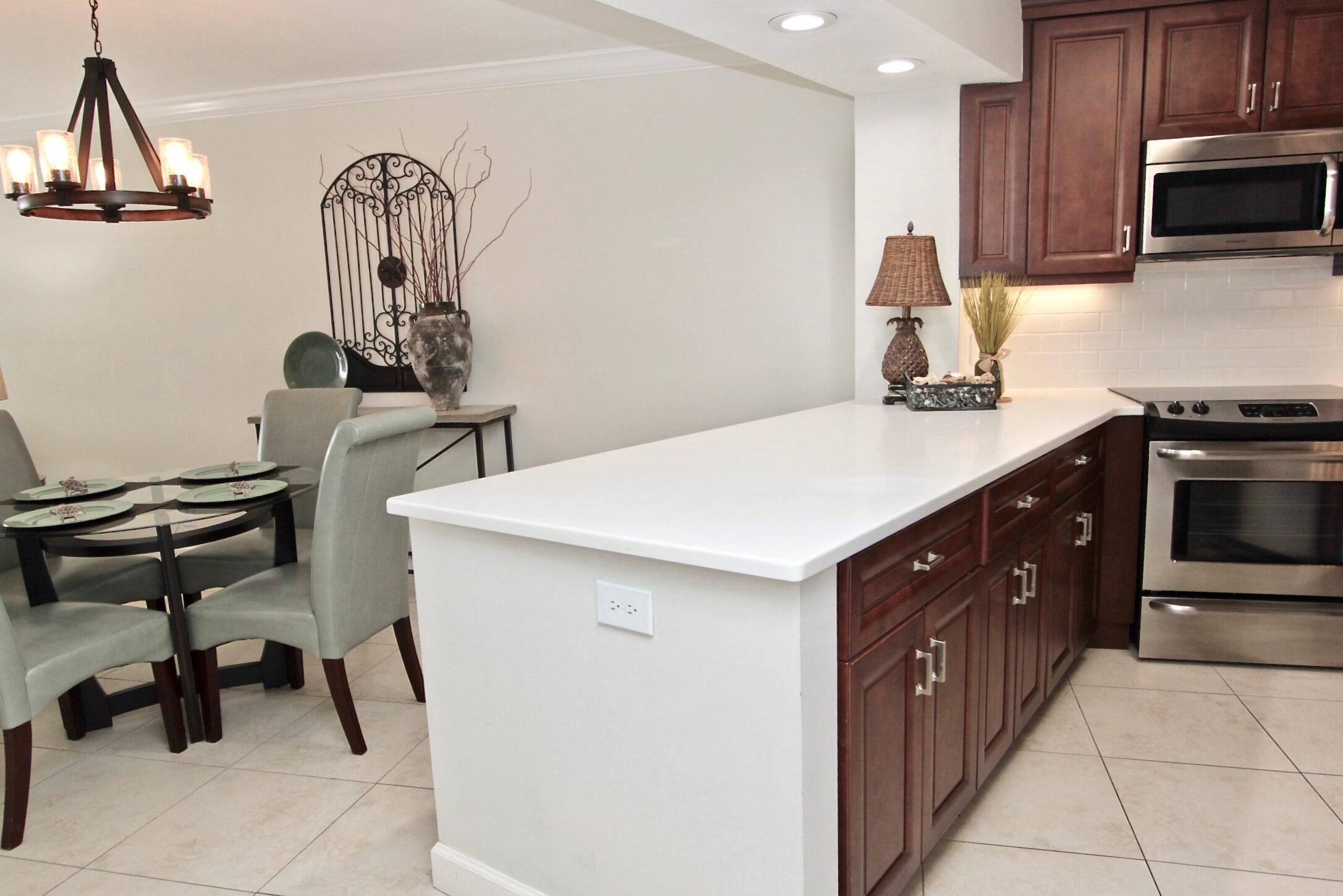 4239 Beachside 2, Unit 239 Miramar Beach, FL 32550 - Photo 12 of 18 a kitchen with a sink cabinets and appliances