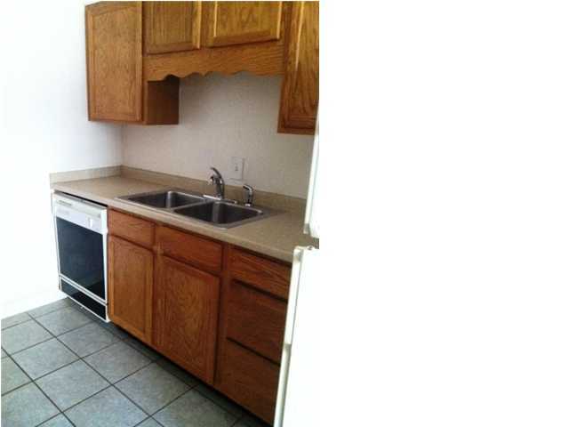 210 Pelham Road, Unit C120 Fort Walton Beach, FL 32547 - Photo 6 of 11 a kitchen with sink and cabinets