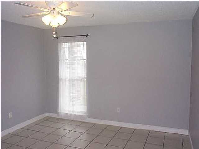 210 Pelham Road, Unit C120 Fort Walton Beach, FL 32547 - Photo 8 of 11 a view of an empty room with a window