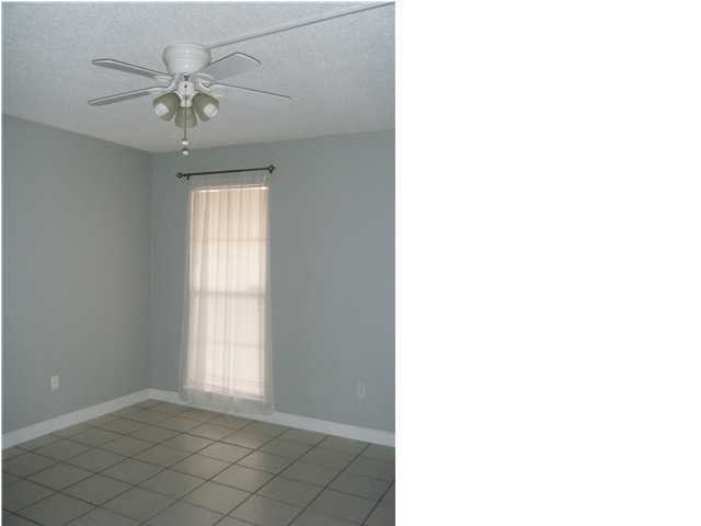 210 Pelham Road, Unit C120 Fort Walton Beach, FL 32547 - Photo 9 of 11 a view of an empty room with a window