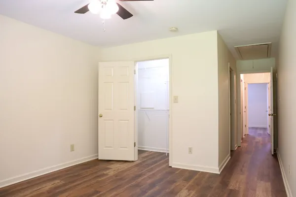 an empty room with wooden floor