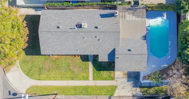 an aerial view of a house with swimming pool