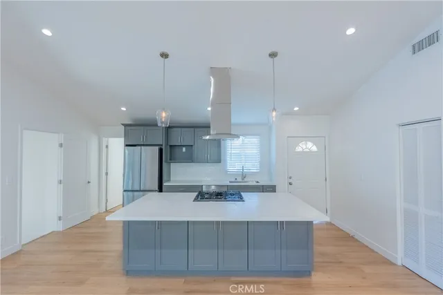 a view of kitchen with cabinets and wooden floor