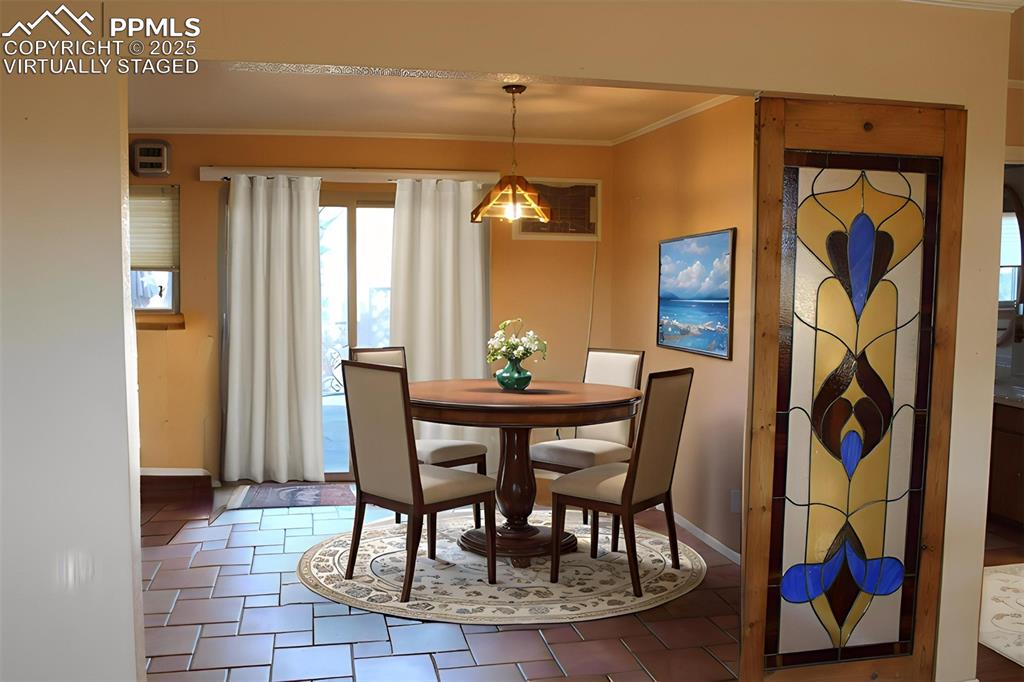 8340 Piute Road Colorado Springs, CO 80926 - Photo 12 of 48 a dining room with furniture and window