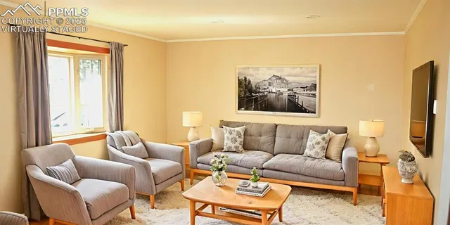 a living room with furniture and a flat screen tv