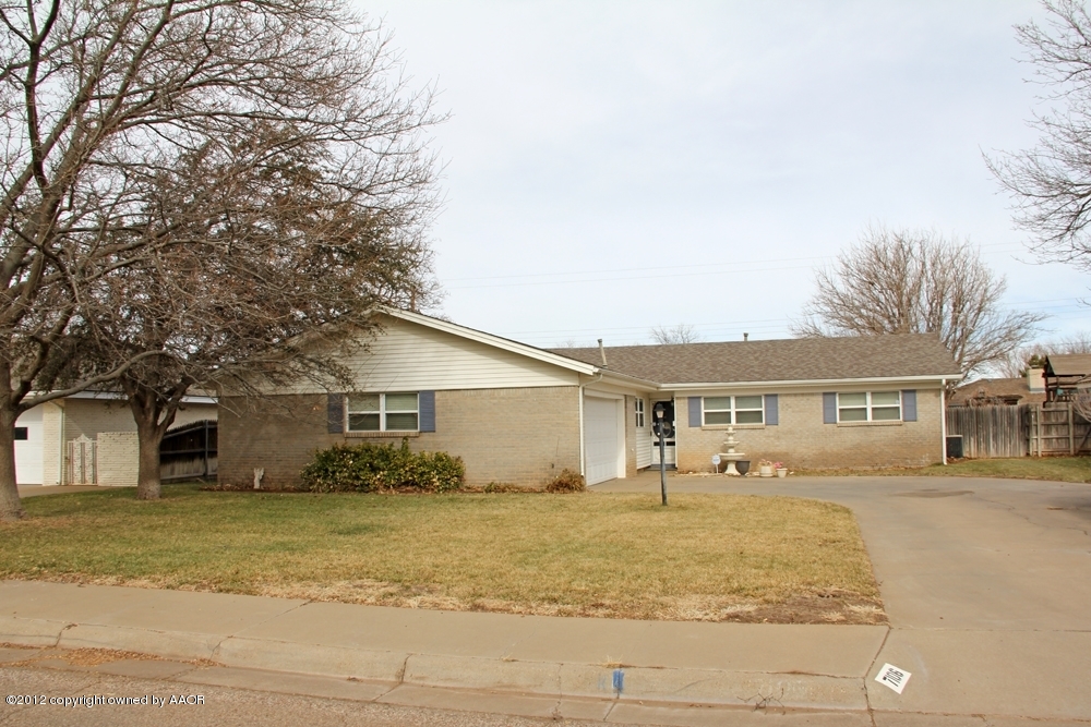 7106 Jameson Road Amarillo, TX 79106 - Photo 1 of 33 a front view of a house with a yard and trees