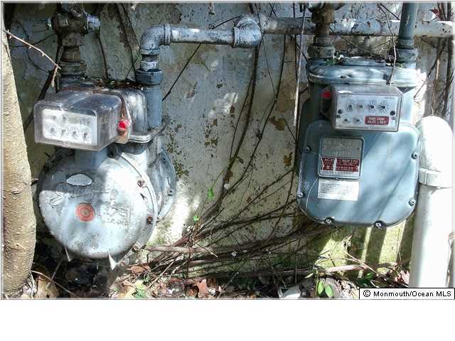 104 Liberty Street Long Branch, NJ 07740 - Photo 5 of 6 a front view of a house with a fountain