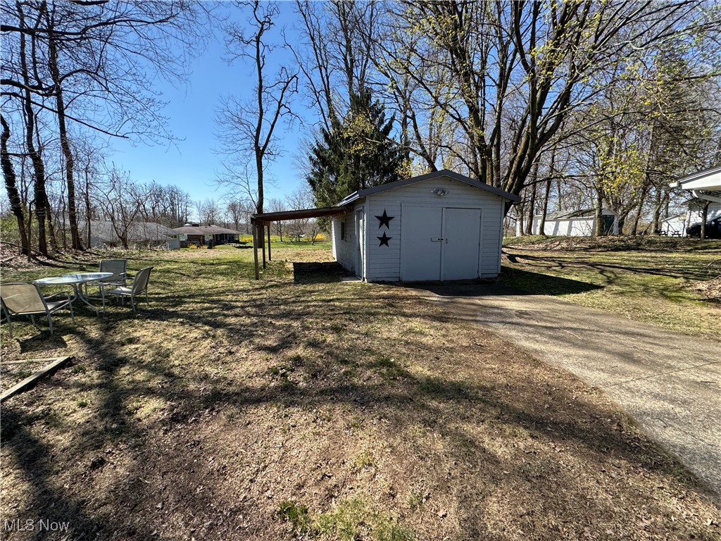 201 West Main Road Conneaut, OH 44030 - Photo 26 of 29 View of yard with an outbuilding and a storage shed