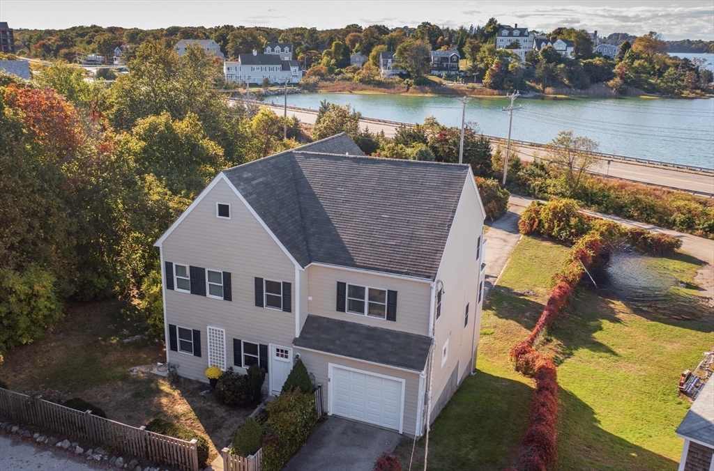 76 Wyola Road Hull, MA 02045 - Photo 1 of 28 an aerial view of a house with a lake view