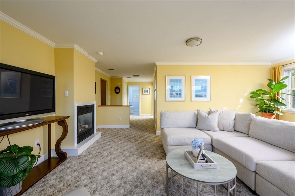 76 Wyola Road Hull, MA 02045 - Photo 11 of 28 a living room with furniture and a flat screen tv