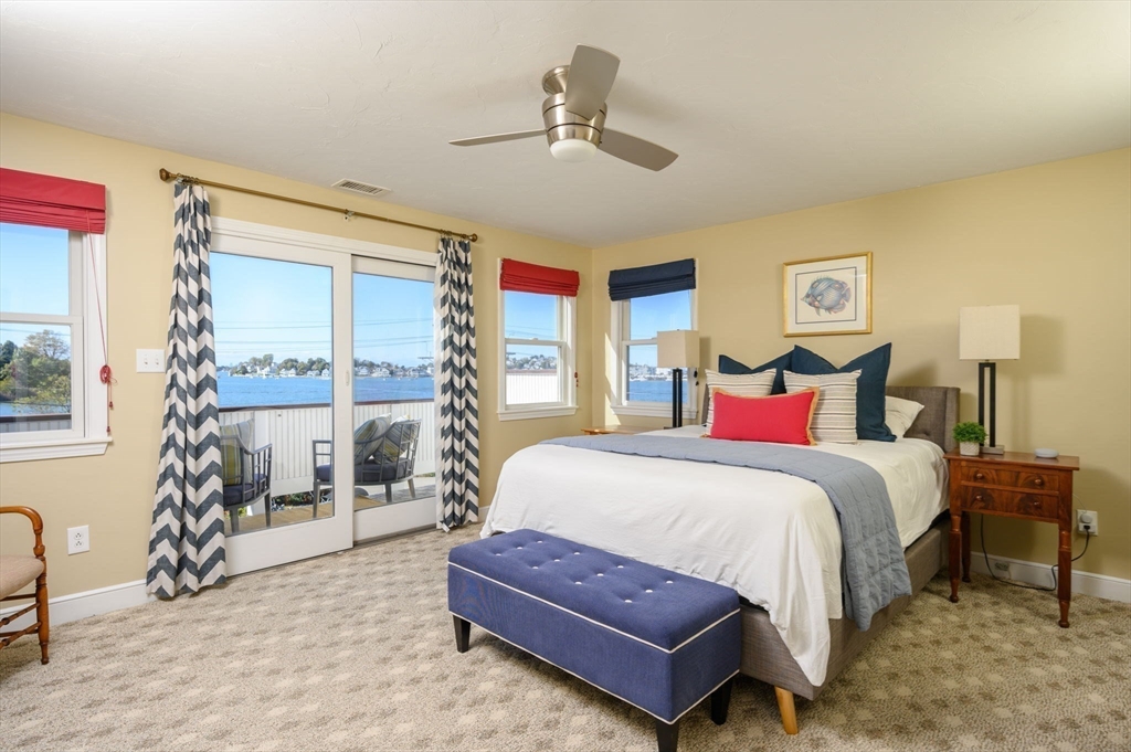 76 Wyola Road Hull, MA 02045 - Photo 12 of 28 a bedroom with a bed and wooden floor