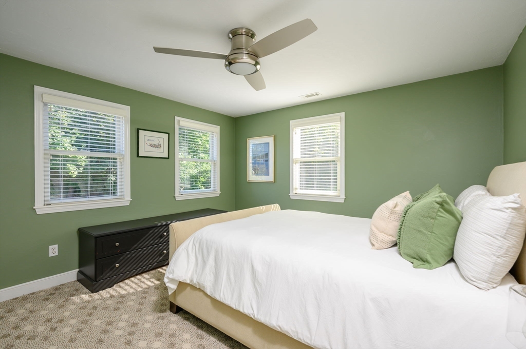 76 Wyola Road Hull, MA 02045 - Photo 15 of 28 a bedroom with a large bed and a window