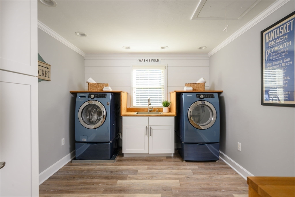 76 Wyola Road Hull, MA 02045 - Photo 17 of 28 a view of washer and dryer in a utility room