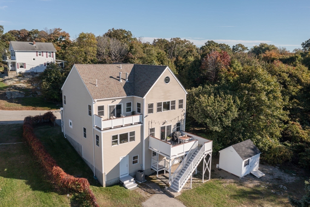 76 Wyola Road Hull, MA 02045 - Photo 20 of 28 an aerial view of a house with a yard