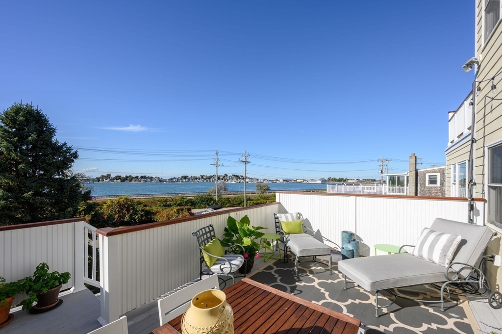 76 Wyola Road Hull, MA 02045 - Photo 3 of 28 a view of a balcony with two chairs and a potted plant