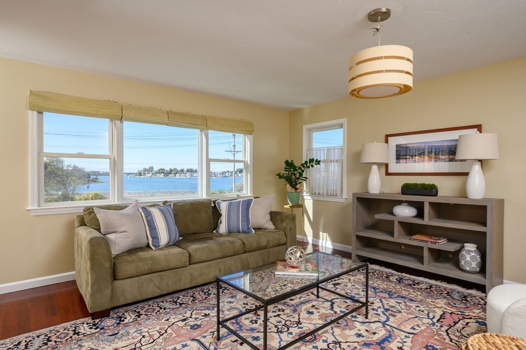 76 Wyola Road Hull, MA 02045 - Photo 8 of 28 a living room with furniture and a large window