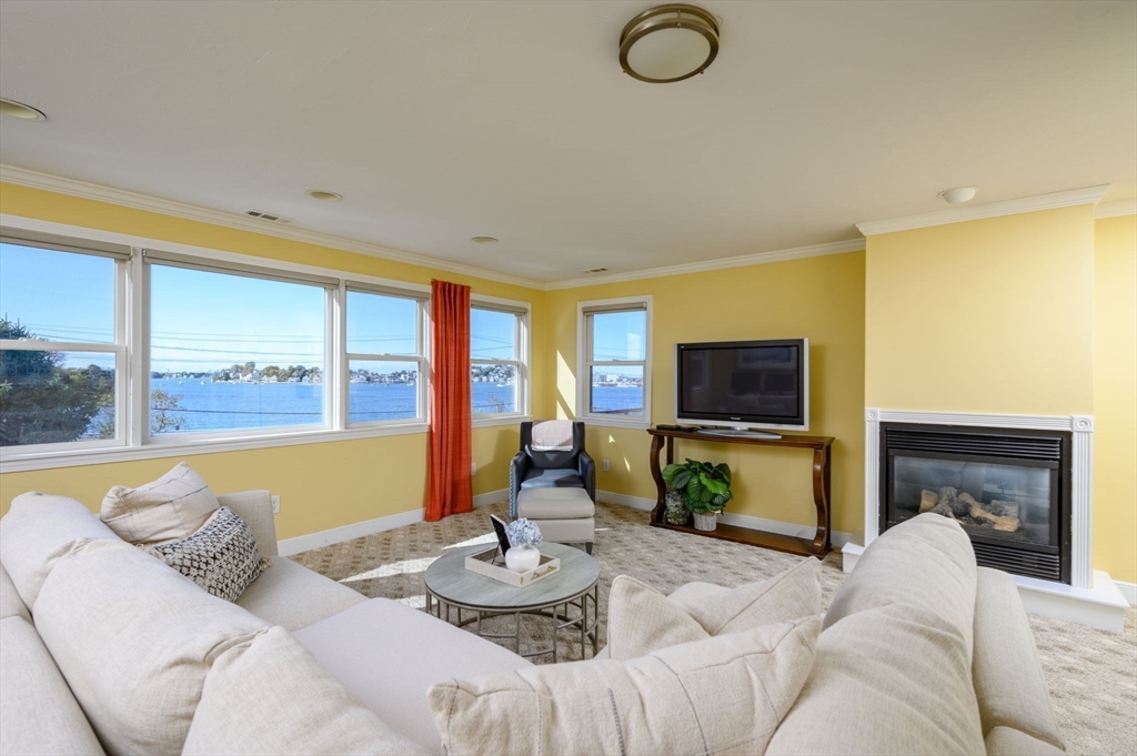76 Wyola Road Hull, MA 02045 - Photo 10 of 28 a living room with furniture and a flat screen tv