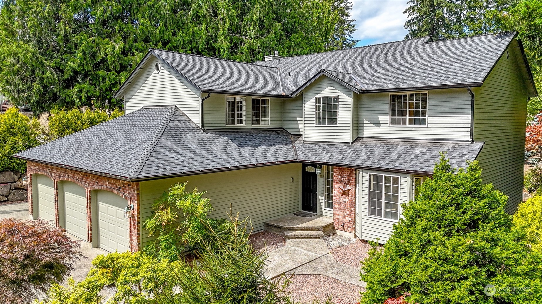 16918 Southeast 149th Street Renton, WA 98059 - Photo 1 of 40 a aerial view of a house with table and chairs under an umbrella