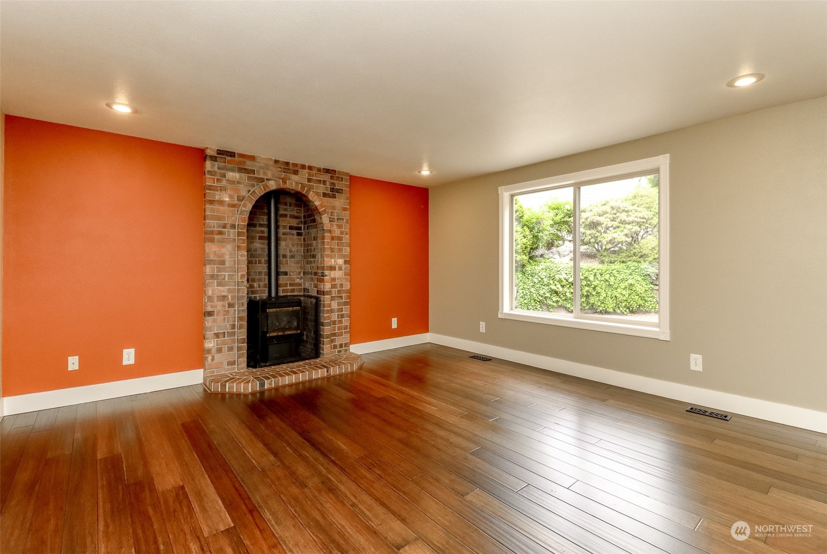 16918 Southeast 149th Street Renton, WA 98059 - Photo 14 of 40 an empty room with wooden floor and windows