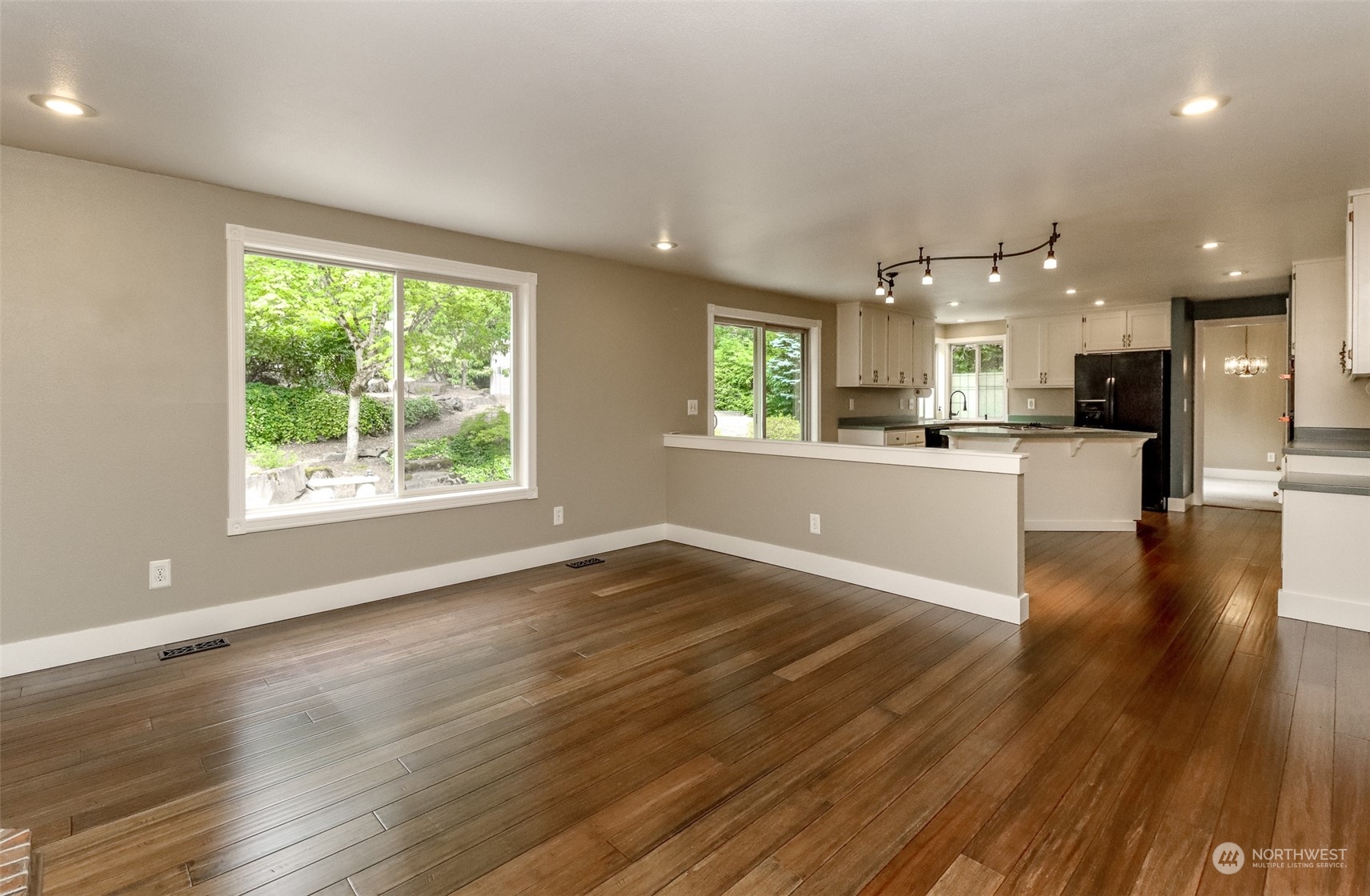 16918 Southeast 149th Street Renton, WA 98059 - Photo 15 of 40 an empty room with wooden floor and windows