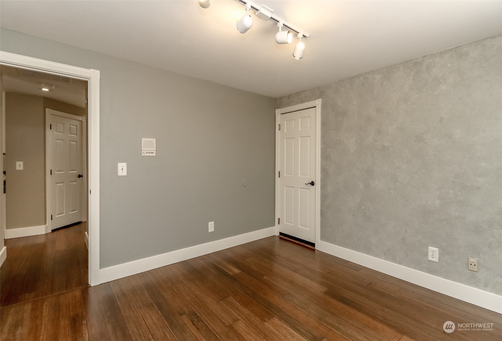 16918 Southeast 149th Street Renton, WA 98059 - Photo 17 of 40 a view of an empty room with wooden floor