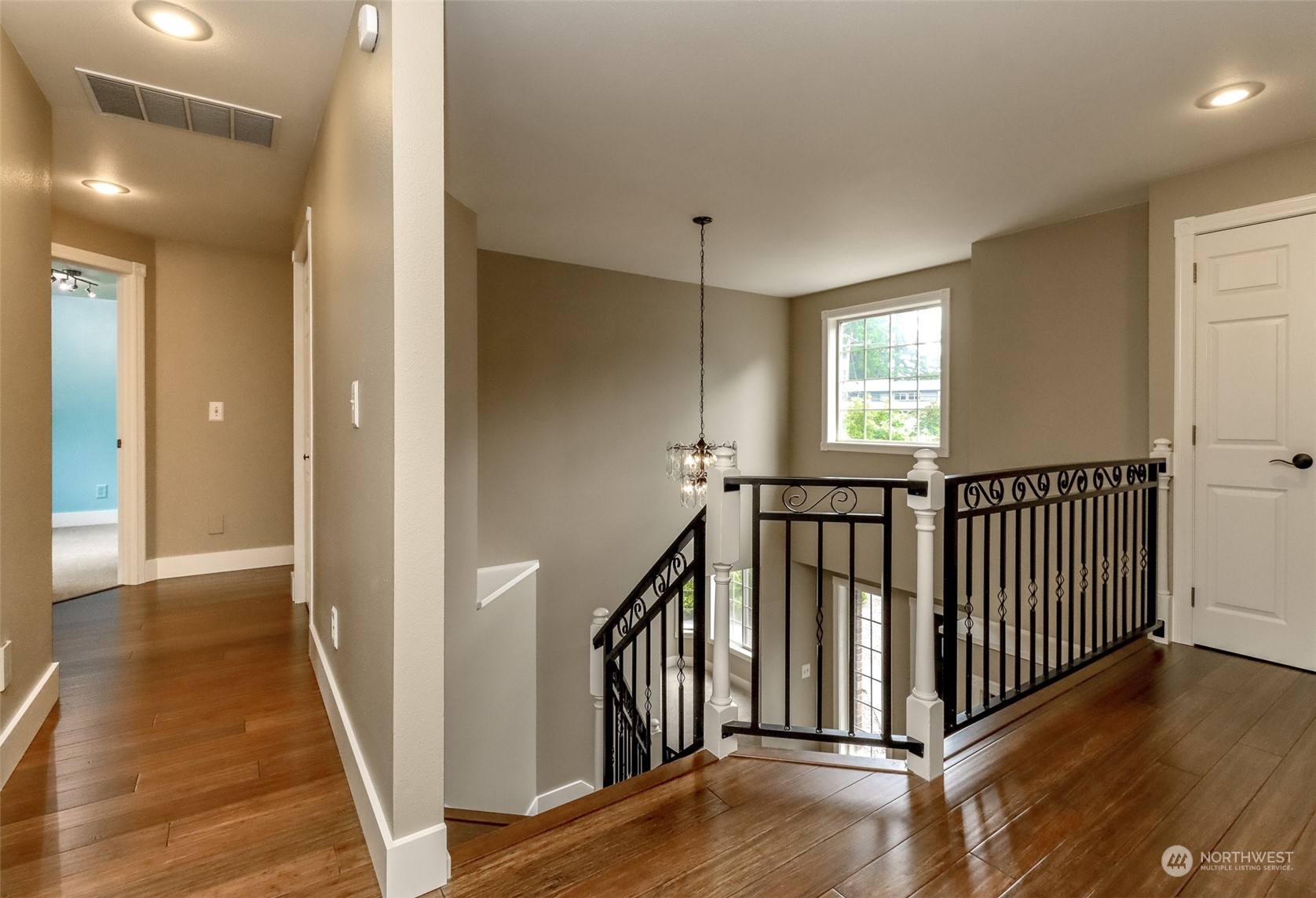 16918 Southeast 149th Street Renton, WA 98059 - Photo 21 of 40 a view of a hallway with windows and stairs