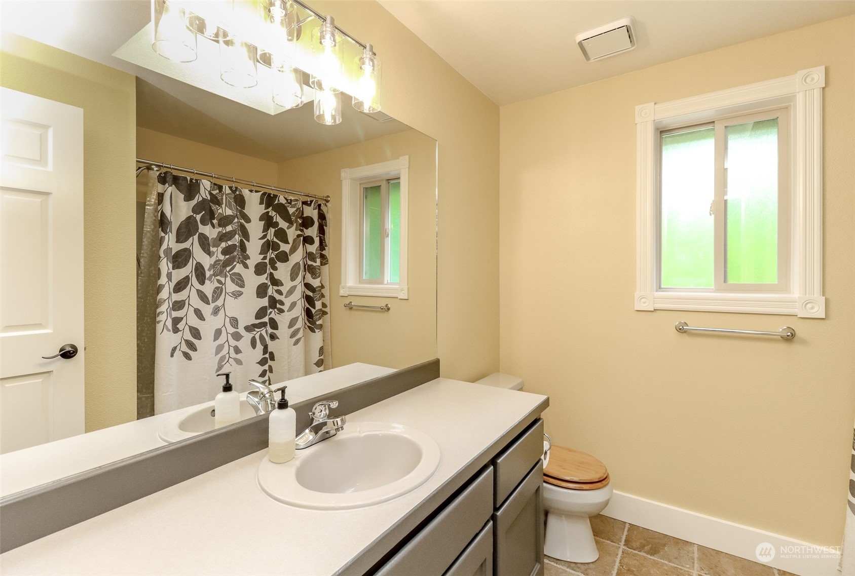 16918 Southeast 149th Street Renton, WA 98059 - Photo 31 of 40 a bathroom with a sink vanity granite and toilet