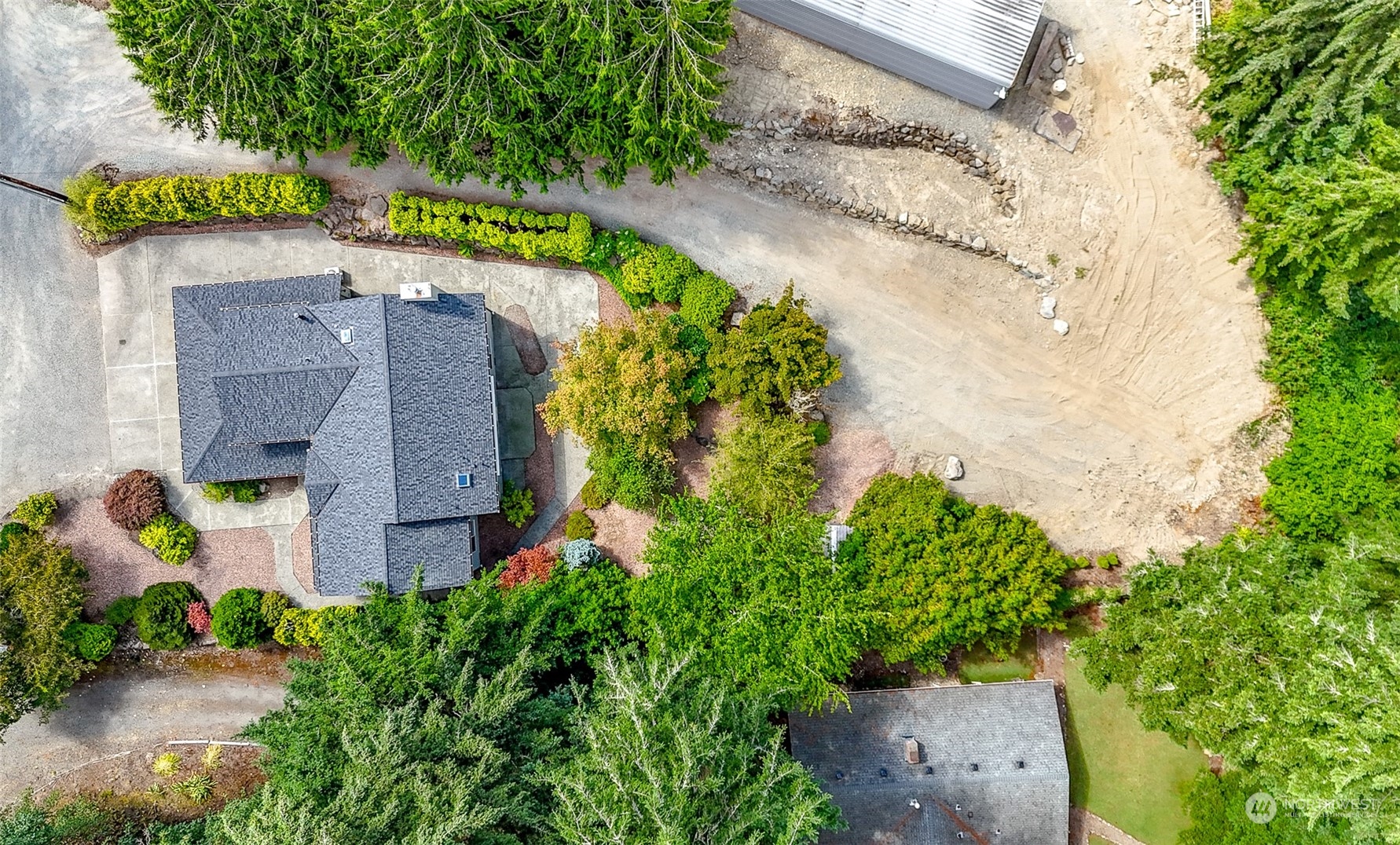 16918 Southeast 149th Street Renton, WA 98059 - Photo 37 of 40 an aerial view of a house with a yard and a garden