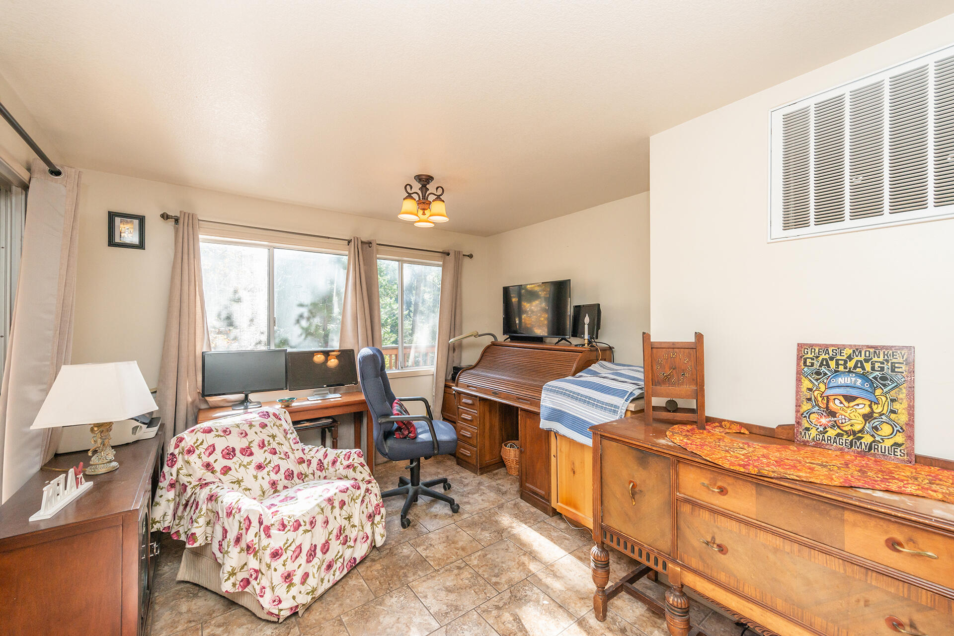 851 Mountain Aire Road Trinity Center, CA 96091 - Photo 45 of 54 a bedroom with furniture and a flat screen tv