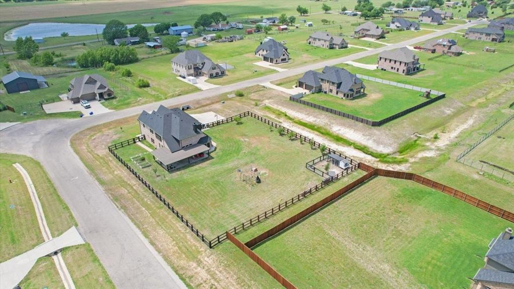 1205 Redbud Street Howe, TX 75459 - Photo 39 of 40 a view of a swimming pool with a yard