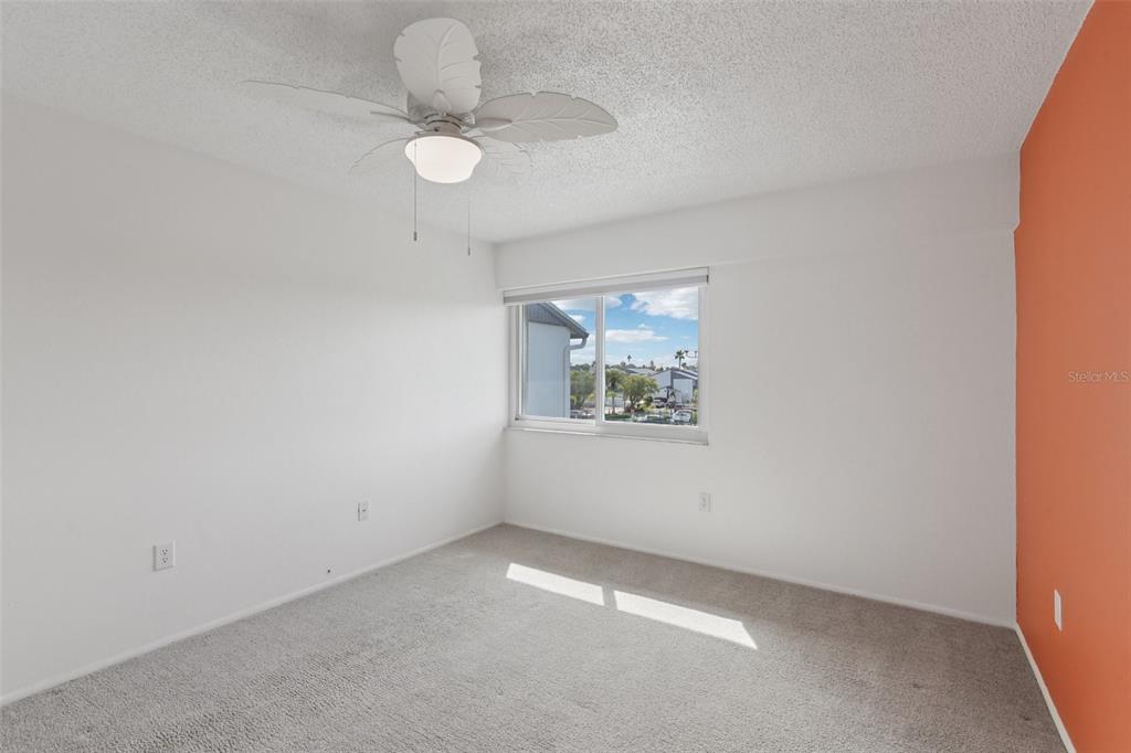 14800 Walsingham Road, Unit 1215 Largo, FL 33774 - Photo 18 of 34 an empty room with a window