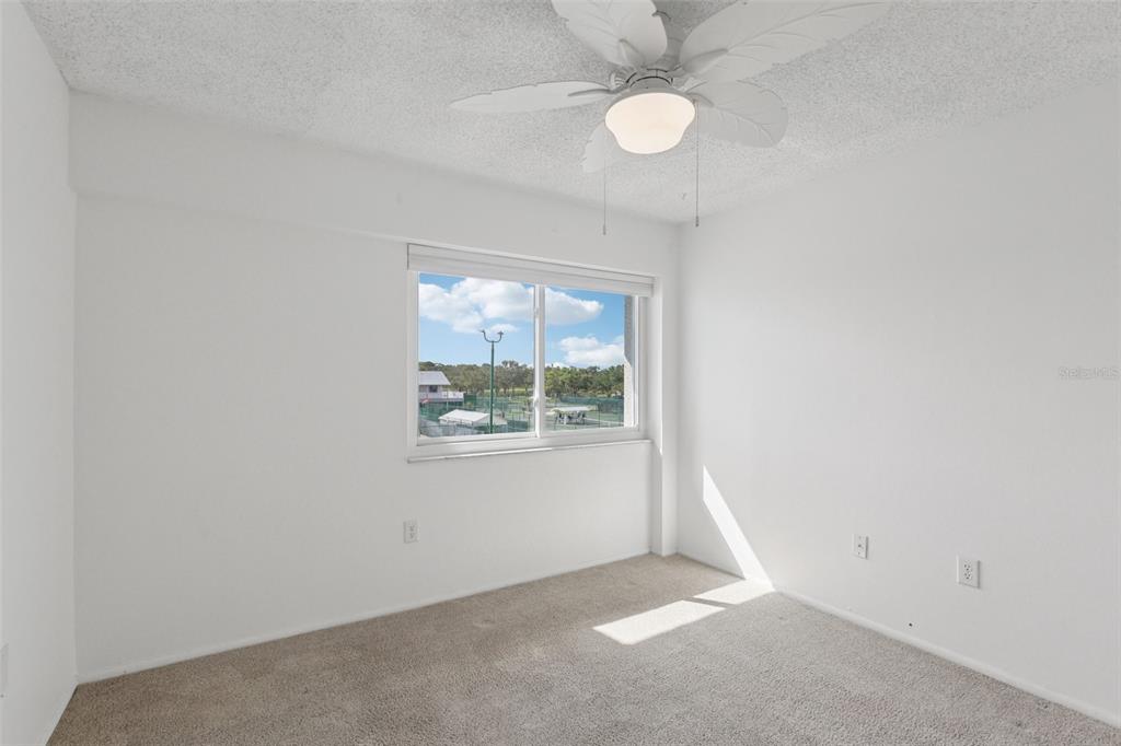 14800 Walsingham Road, Unit 1215 Largo, FL 33774 - Photo 24 of 34 an empty room with a window