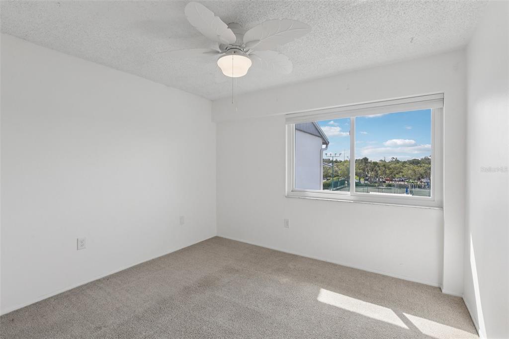 14800 Walsingham Road, Unit 1215 Largo, FL 33774 - Photo 25 of 34 an empty room with a window