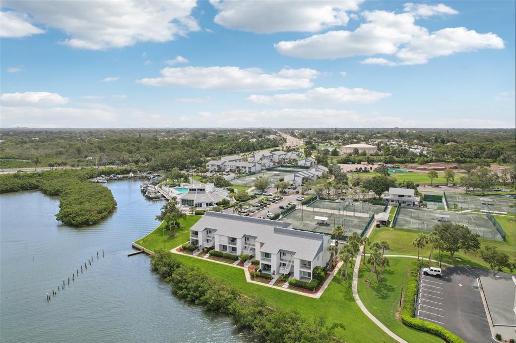 14800 Walsingham Road, Unit 1215 Largo, FL 33774 - Photo 31 of 34 an aerial view of a house with outdoor space swimming pool and mountains in the background