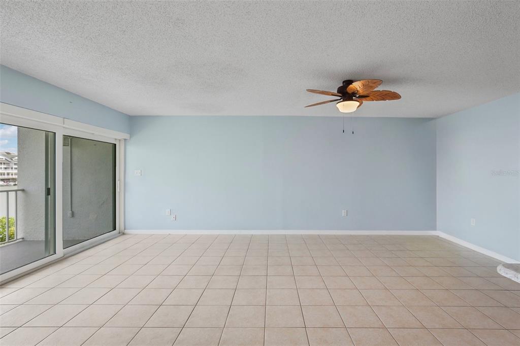 14800 Walsingham Road, Unit 1215 Largo, FL 33774 - Photo 7 of 34 a view of a room with a window and wooden floor
