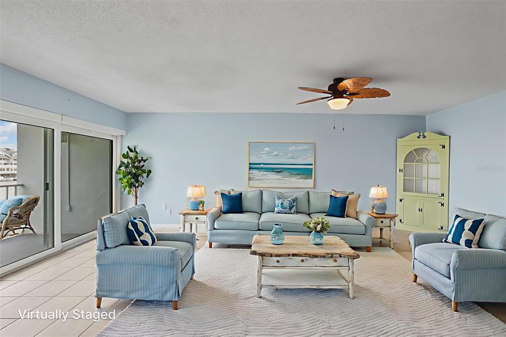 14800 Walsingham Road, Unit 1215 Largo, FL 33774 - Photo 8 of 34 a living room with furniture a rug and a window
