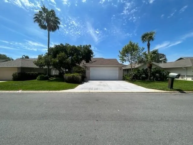 a house view with a garden space