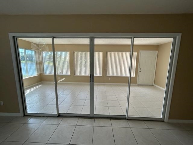 625 Nautical Way St. Augustine, FL 32080 - Photo 17 of 18 a view of an empty room with wooden floor and a window