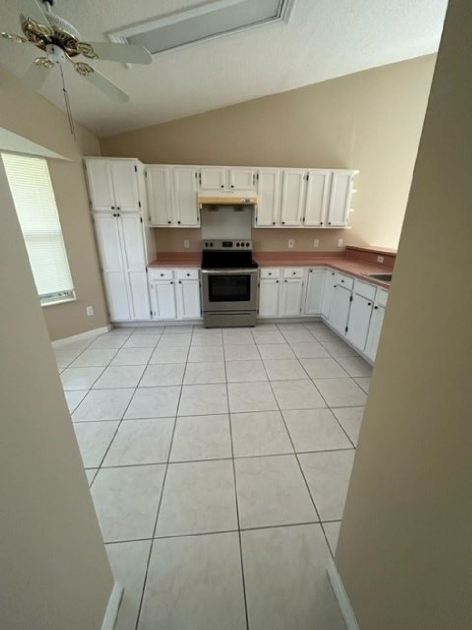 625 Nautical Way St. Augustine, FL 32080 - Photo 3 of 18 a kitchen with a sink a stove and cabinets