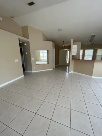 a view of an empty room and window