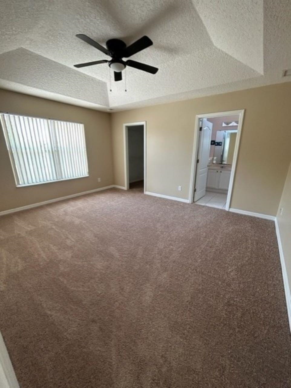 625 Nautical Way St. Augustine, FL 32080 - Photo 9 of 18 an empty room with windows and fan