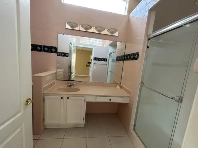 a bathroom with a sink and mirror