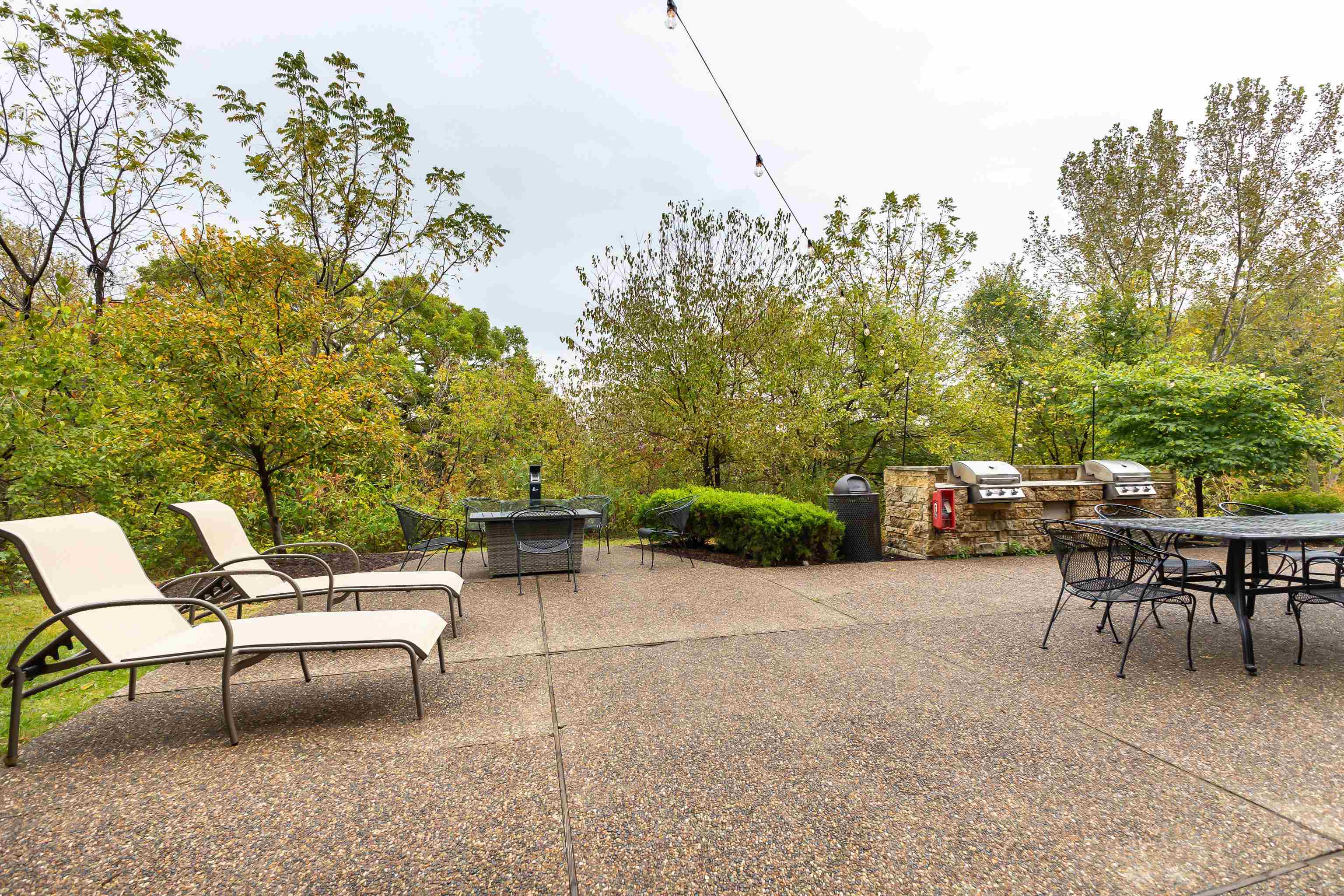 5129 West Longhollow Road Galena, IL 61036 - Photo 16 of 20 a view of a patio with table and chairs and potted plants