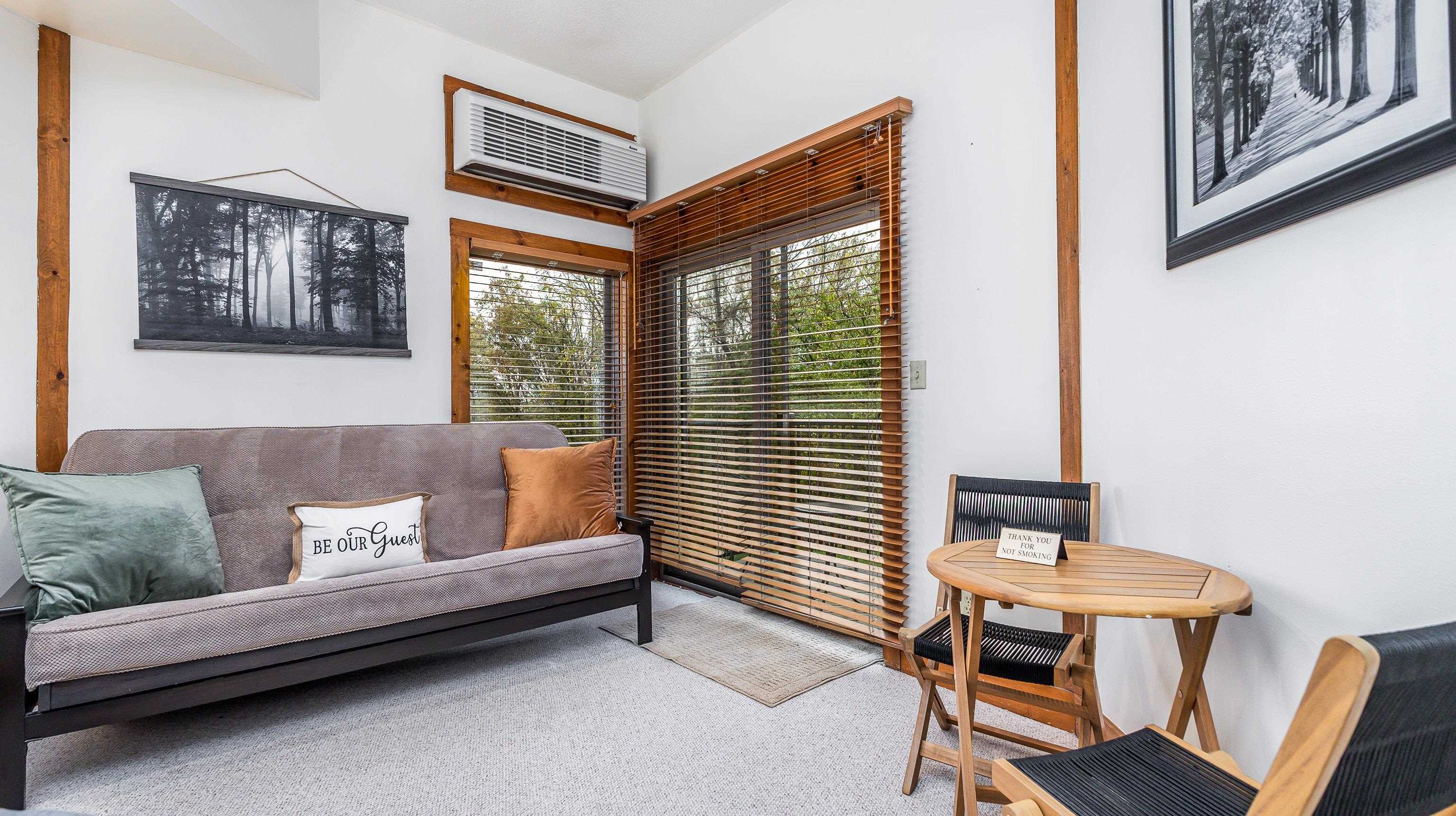 5129 West Longhollow Road Galena, IL 61036 - Photo 4 of 20 a living room with furniture and a window