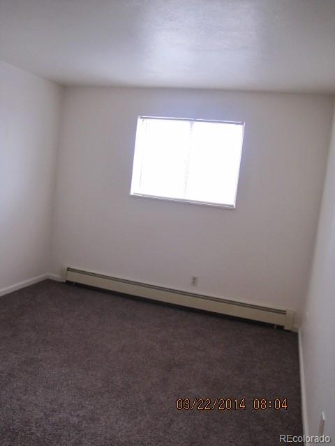 9340 West 49th Avenue, Unit 218 Wheat Ridge, CO 80033 - Photo 3 of 8 an empty room with a window
