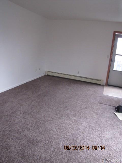 9340 West 49th Avenue, Unit 218 Wheat Ridge, CO 80033 - Photo 4 of 8 a view of a room with an empty space