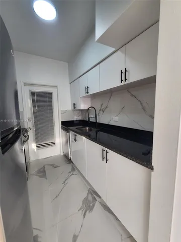 a kitchen with stainless steel appliances refrigerator and stove