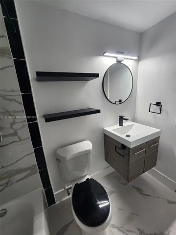 a bathroom with a shower and toilet
