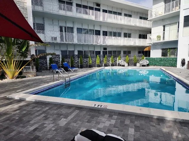 a view of a swimming pool with a patio